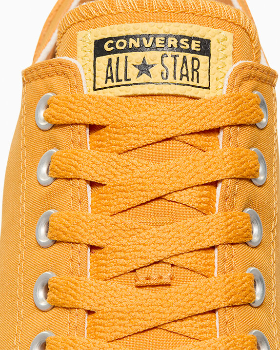 Chuck Taylor All Star de caña baja de poliéster y gamuza